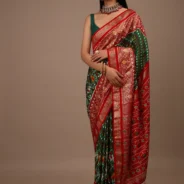 bottle_green_saree_in_silk_with_multi_colored_patola.webp