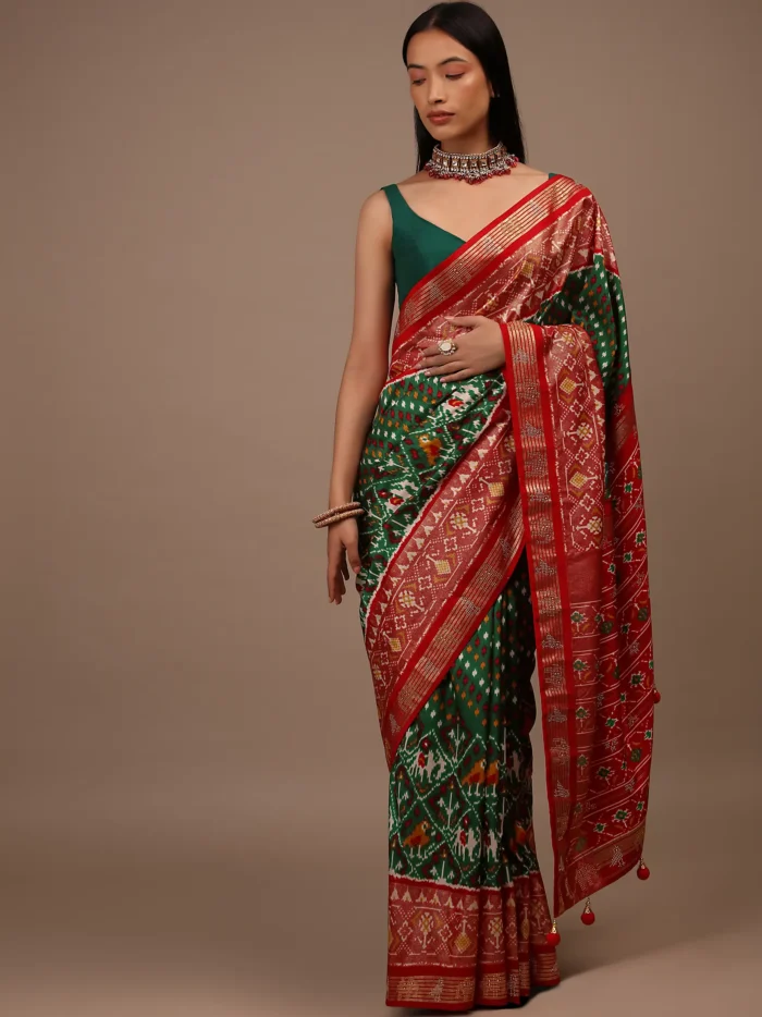 bottle_green_saree_in_silk_with_multi_colored_patola1.webp