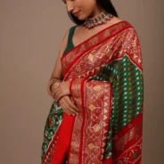 bottle_green_saree_in_silk_with_multi_colored_patola2.webp