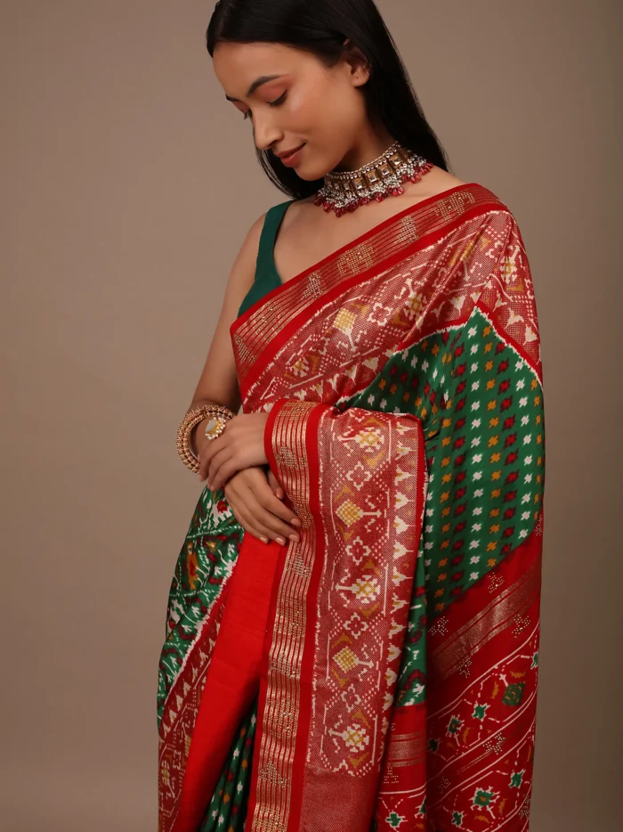 bottle_green_saree_in_silk_with_multi_colored_patola2.webp