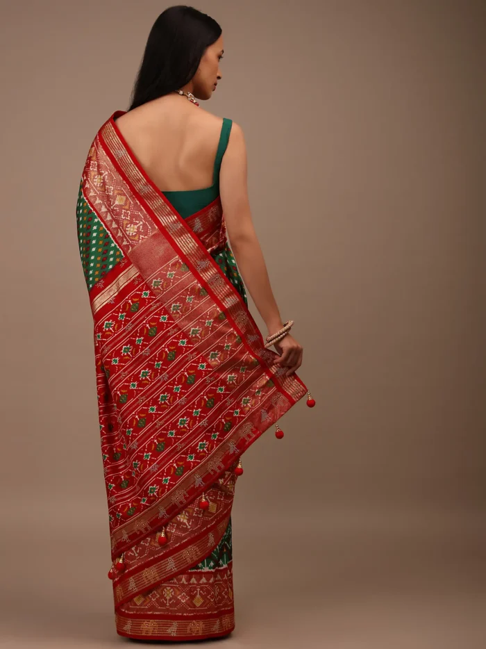 bottle_green_saree_in_silk_with_multi_colored_patola3.webp