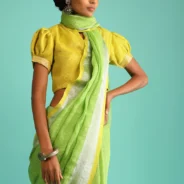 parrot-green-saree-in-linen-with-silver-brocade-border-and-striped-pallu-along-with-yellow-unstitched-blouse2.webp
