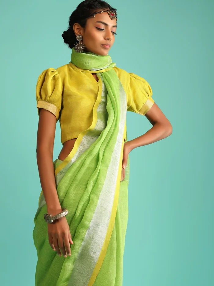 parrot-green-saree-in-linen-with-silver-brocade-border-and-striped-pallu-along-with-yellow-unstitched-blouse2.webp