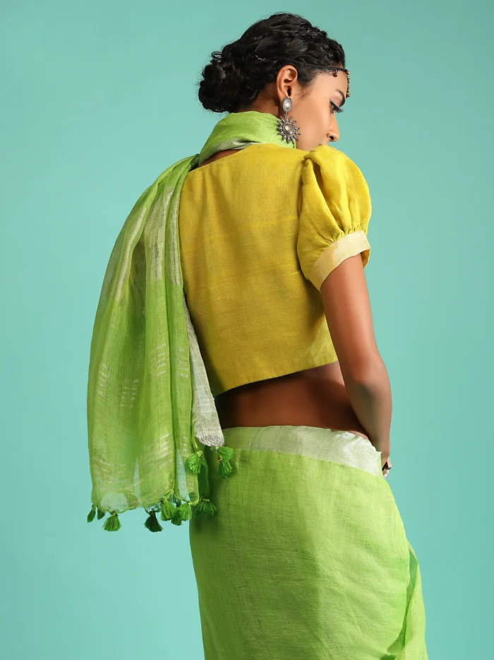 parrot-green-saree-in-linen-with-silver-brocade-border-and-striped-pallu-along-with-yellow-unstitched-blouse3.webp